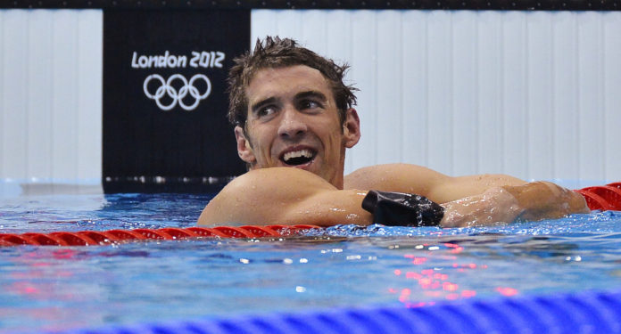 Michael Phelps of the U.S. smiles after winning the men's 4x200m freestyle relay final to get his 19th Olympic medal during the London 2012 Olympic Games at the Aquatics Centre